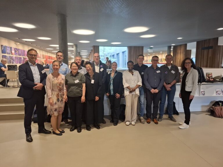 Group of participants at the IDF/ISO Analytical Week 2026 gathered in an indoor venue in Bern, Switzerland.